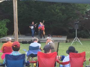 One of the groups performing at Music in the Garden - this is a 3-person group playing a guitar, banjo, and string bass.