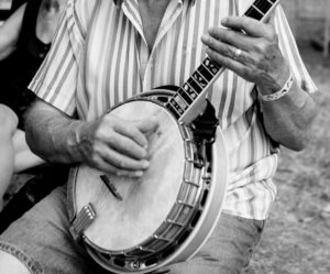 Older man playing a banjo