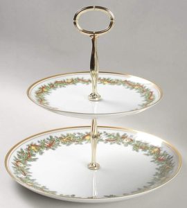 two-tiered serving plate with a Christmas greenery pattern