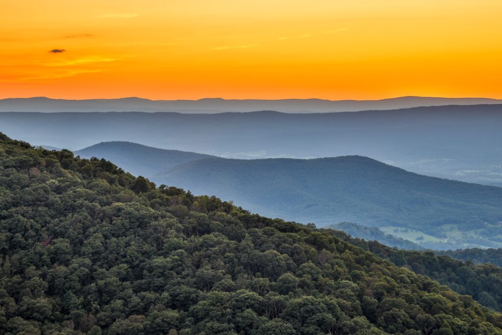 Gorgeous sunrise over the Shenandoah Mountains of Virginia - it's one of the most unique places to visit in Virginia