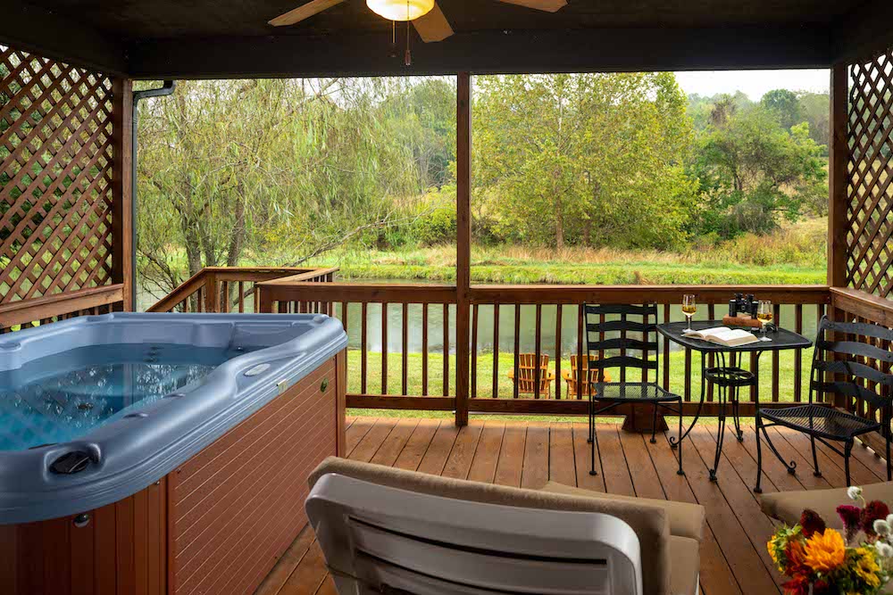 Enjoy the private hot tub and deck at our stunning cabins in Virginia, co-located with our Lexington Bed and Breakfast