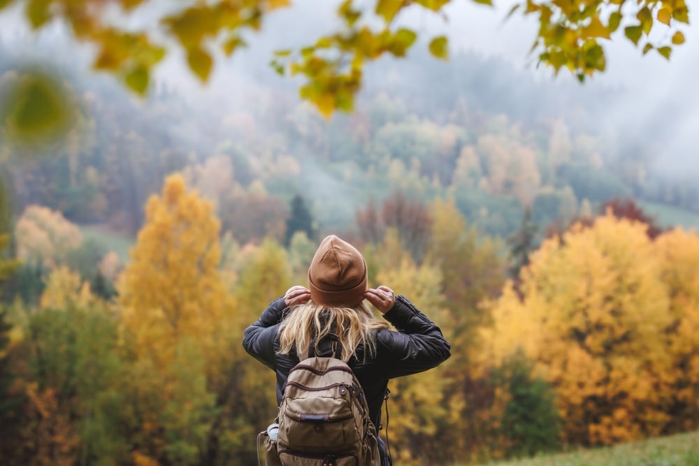 Woman enjoying a fall hike in Shenandoah National Park Fall Foliage