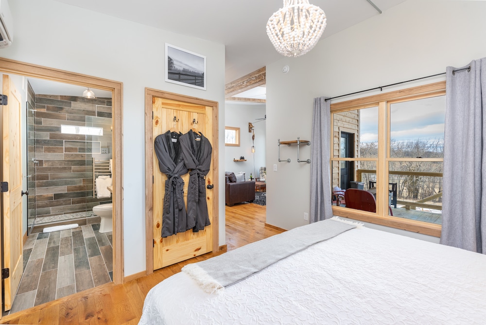 Guest room overlooking the landscape outside at our romantic cabins in Virginia