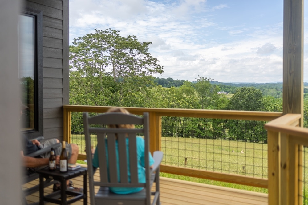 Sitting on the porch of our cabins - one of the most unique getaways in Virginia