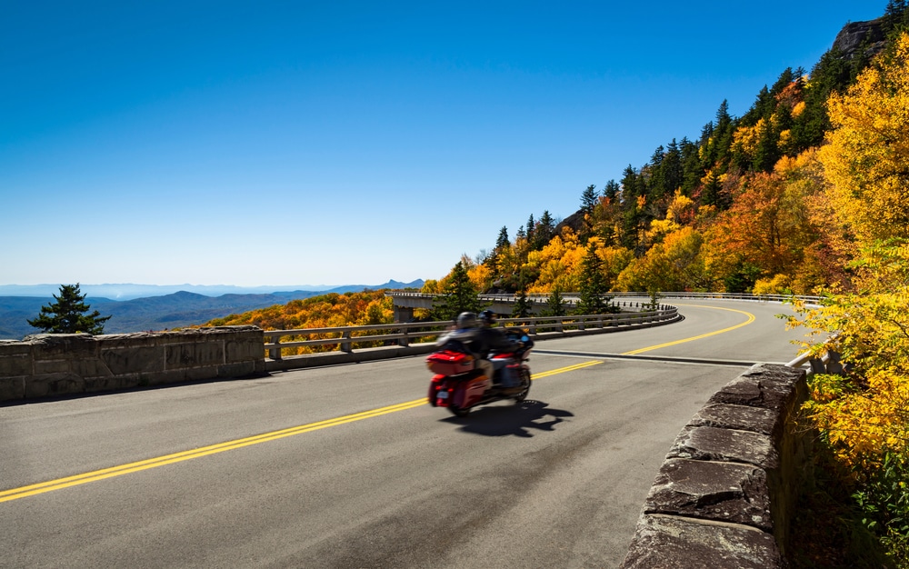Motorcycle enjoying fall on a Blue Ridge Parkway Road Trip, one of the most unique getaways in Virginia