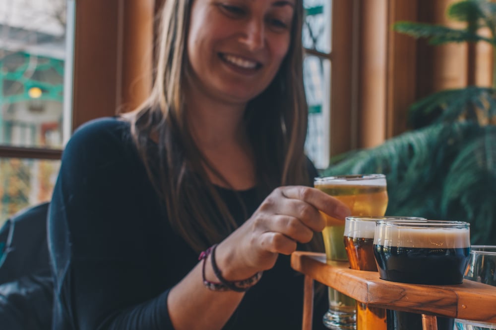 Woman drinking beer at Devils Backbone Brewery in Lexington, VA